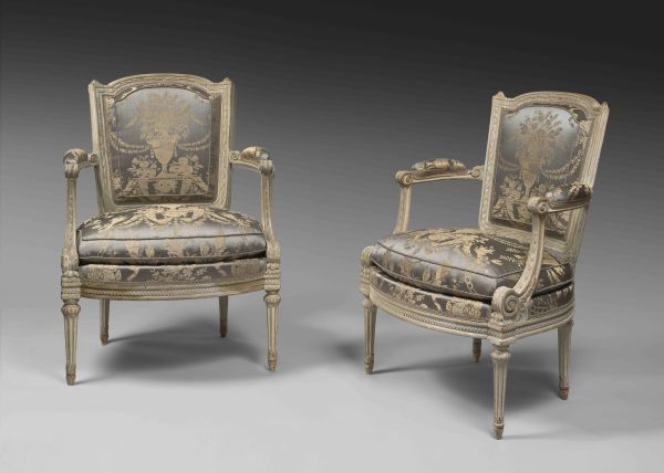 A louis XVI laquered wood pair of armchairs