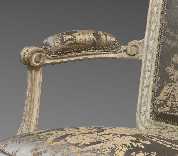 A louis XVI laquered wood pair of armchairs