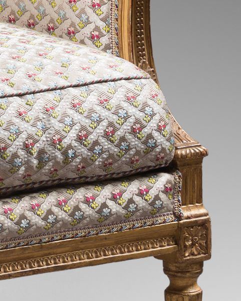 A pair of Louis XVI gilded wood bergeres