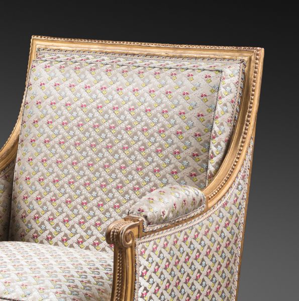 A pair of Louis XVI gilded wood bergeres