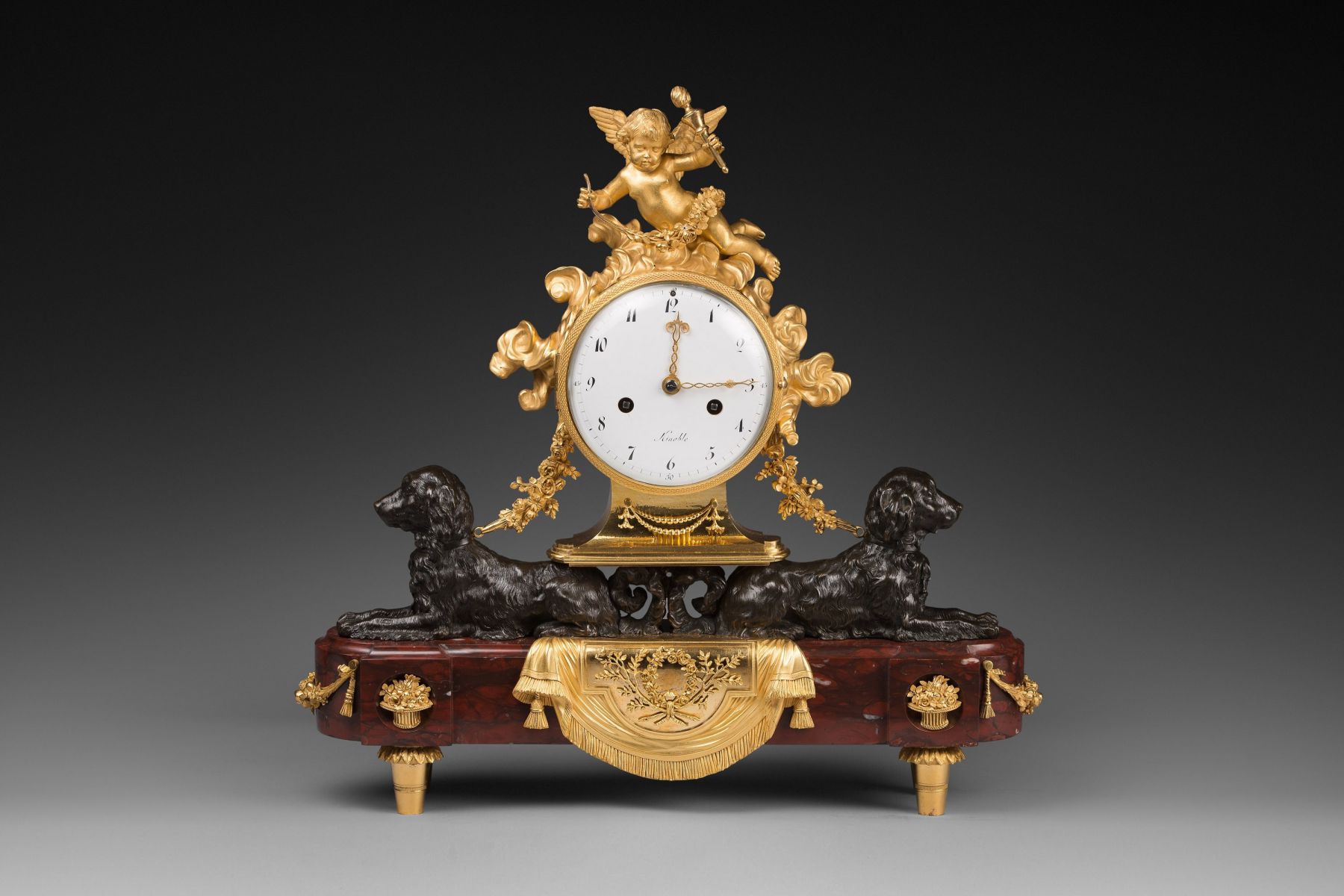 A Louis XVI ormolu, patinated bronze and rouge griotte marble mantel clock