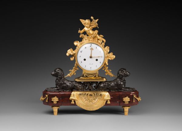 A Louis XVI ormolu, patinated bronze and rouge griotte marble mantel clock