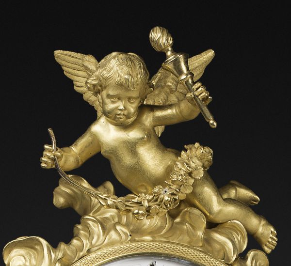 A Louis XVI ormolu, patinated bronze and rouge griotte marble mantel clock