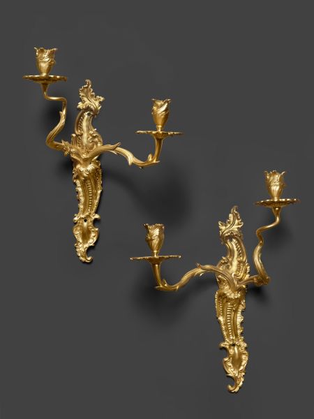 A pair of French early Louis XV ormolu twin-branch wall-lights