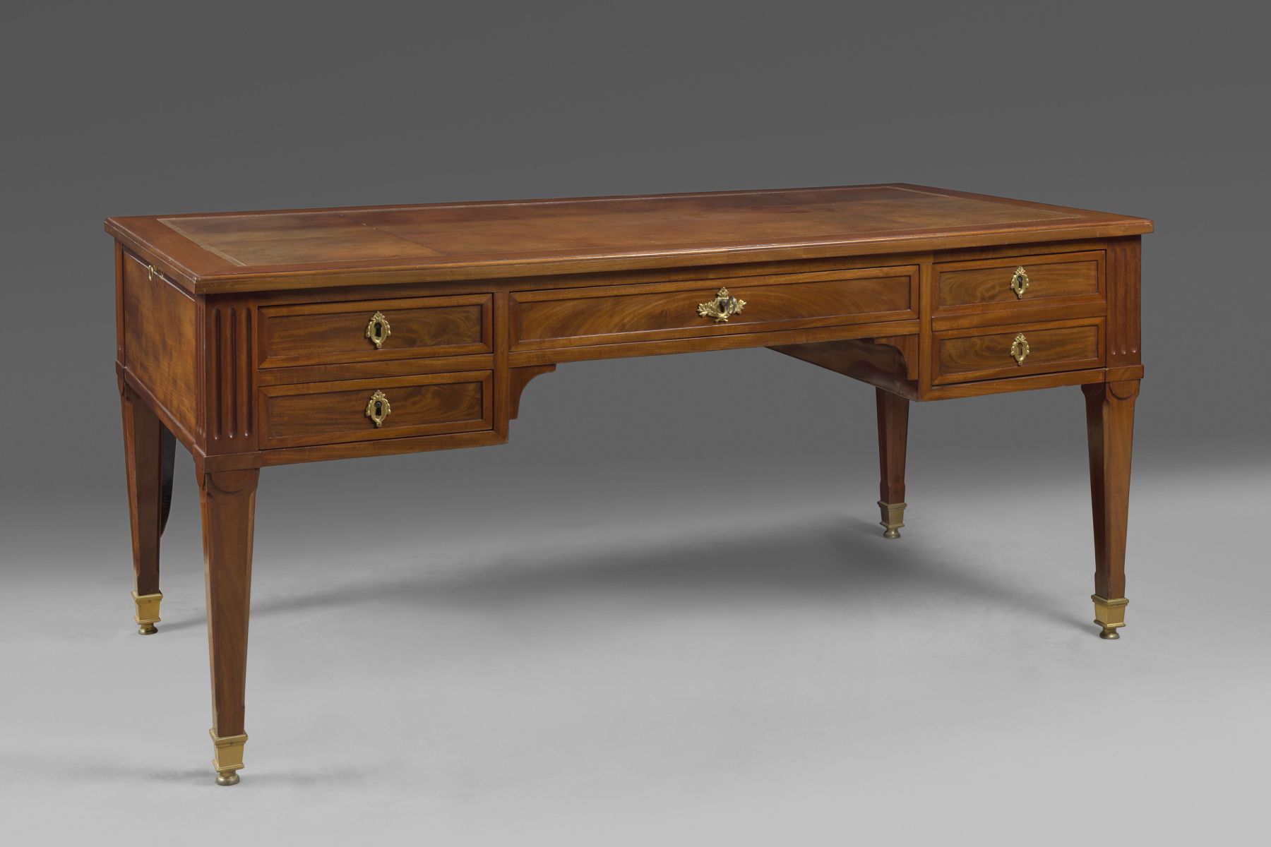 A Louis XVI mahogany bureau plat